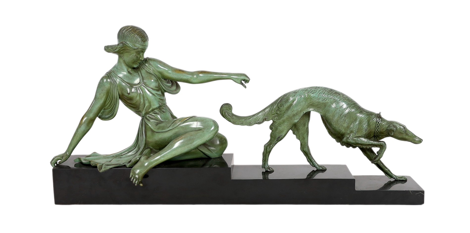 Armand Godard. A French Art Deco patinated bronze and black marble group of a classical woman and borzoi, 80cm wide, 37cm high